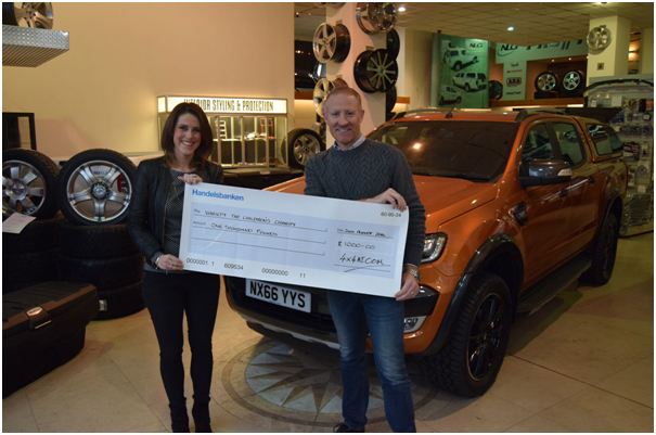 Tim Snowden MD at 4x4 Accessories & Tyres Ltd with Charlotte Farrington of Variety The Childrens Charity.