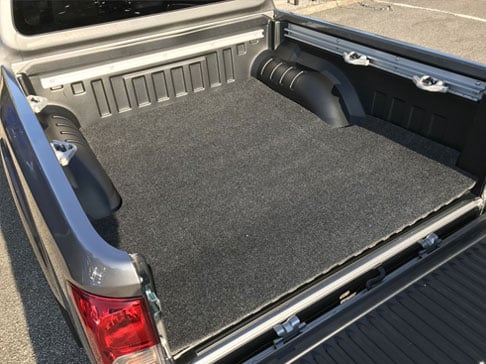 Bedmat Fitted To A Plastic Load Bed Liner Of A Pickup Truck