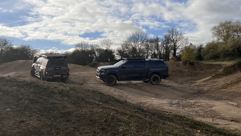 Next gen Ford Ranger vs Toyota Hilux off-road terrain challenges, over ruts and steep inclines