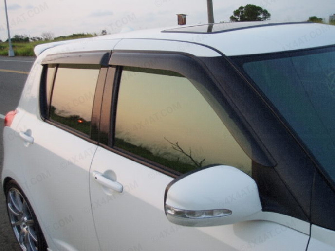 Dark smoke, tinted Suzuki Swift 4dr 2005 on wind deflectors