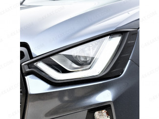 Black headlamp surround fitted to an Isuzu Dmax