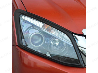 Black headlamp surround fitted to an Isuzu Dmax