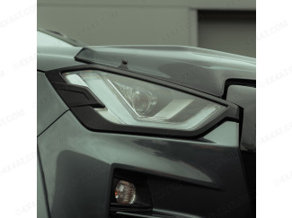 Black headlamp surround fitted to an Isuzu Dmax