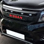 Side angle view of the Navara NP300 Black Grille with LEDs and Red Logo