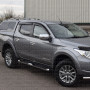 Mitsubishi L200 fitted with window visors, bonnet guard, side boards, alloy wheels and spoiler bar