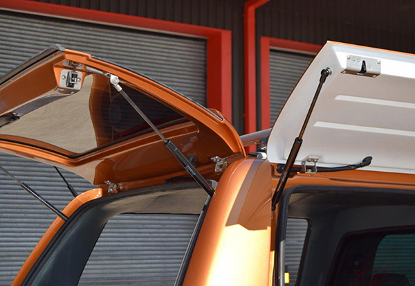 Ford Ranger fitted with an Alpha gullwing truck top canopy in pride orange