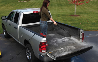 Open rear door of pickup with moulded to fit Bed Rug