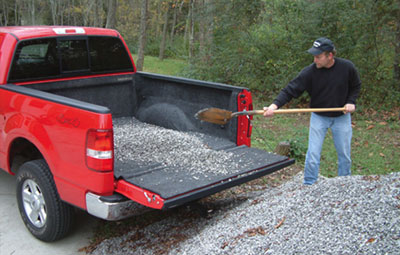 Highly Functional Liner with gravel being shovelled onto the bed rug