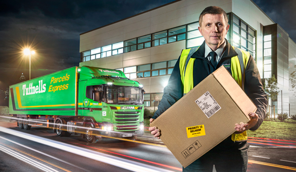 Tuffnells employee in front of the Tuffnells lorry
