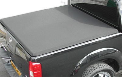 Top view of the hard tri folding load bed cover on a Nissan Navara