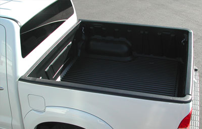 Over rail bed liner on a double cab pickup truck