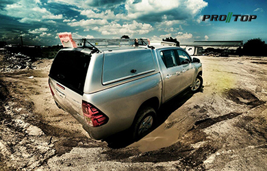 Pro//Top Low Roof Gullwing Canopy on a Toyota Hilux