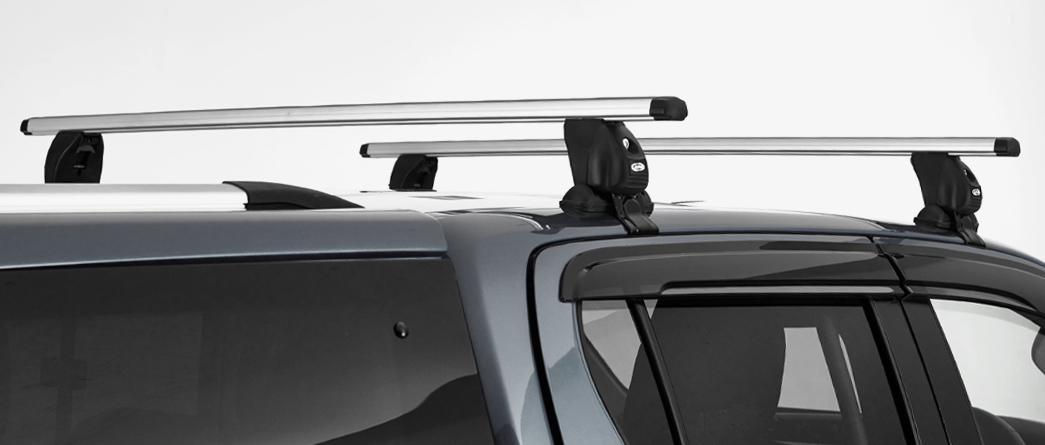 Roof bars for vehicles and pickup trucks