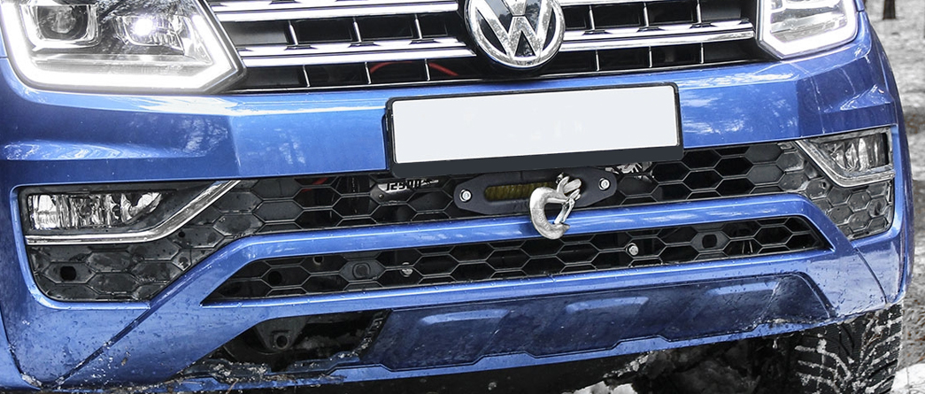 Hidden winch mounts for pickup trucks